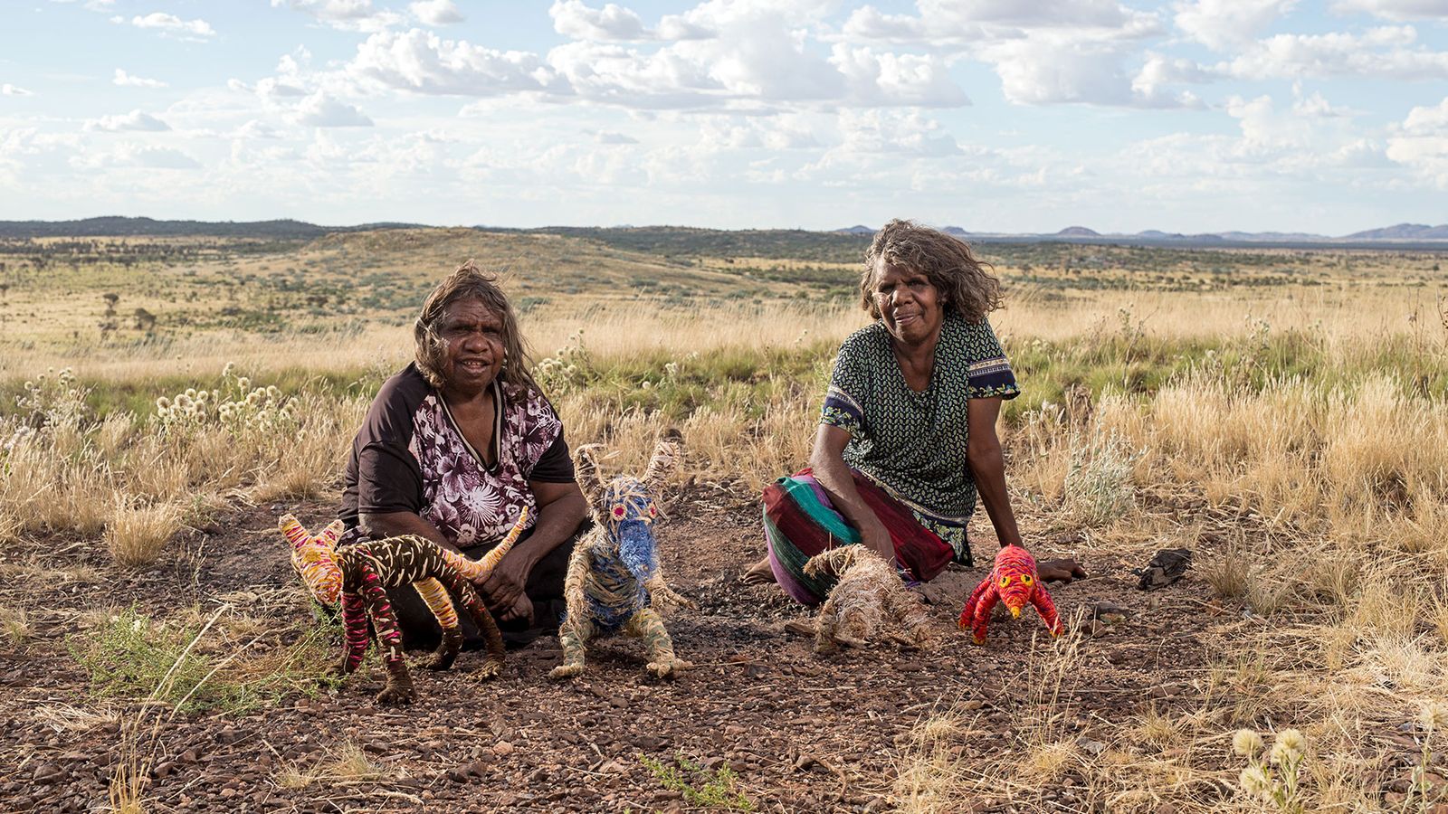 Photo of Roma Butler and Yangi Yangi Fox sitting side by side outside