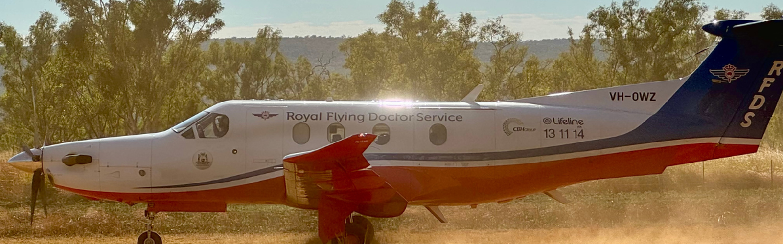 PC-12 taking off from a paddock.