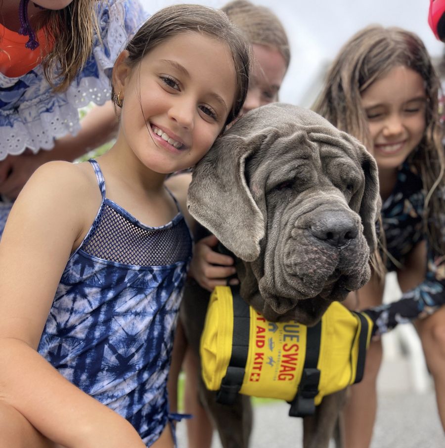 Emily with Shadow the dog and a Rescue Swag