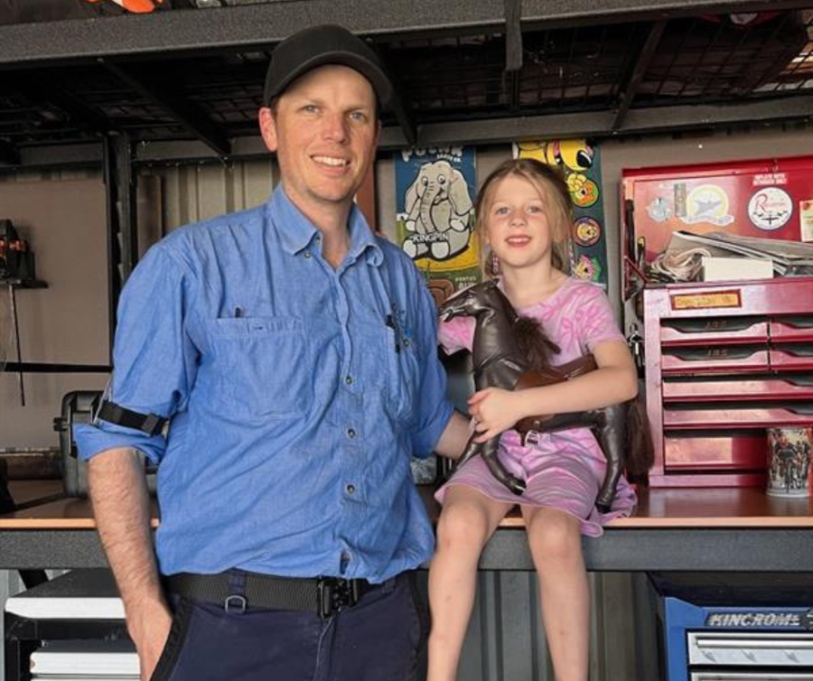 Nick with his daughter at home