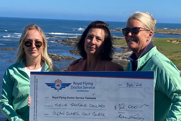 Caroline Wells, RFDS Tasmania Board Chair accepts cheque from Ocean Dunes Manager Amanda Jones