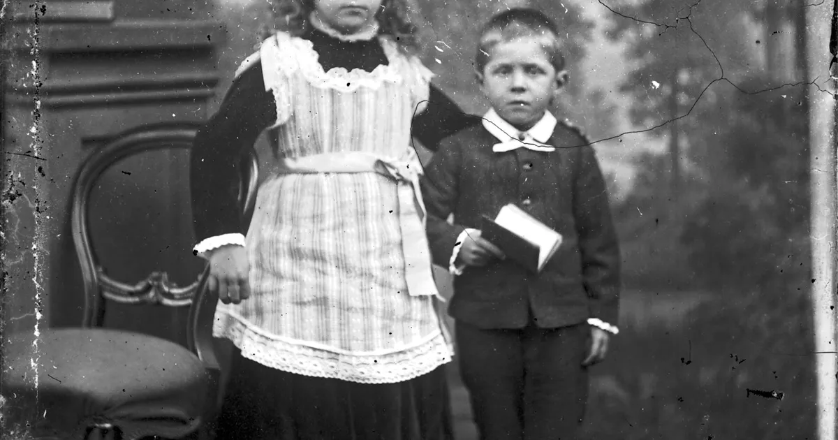 Portrait of girl with arm around little boy - AGSA Collection