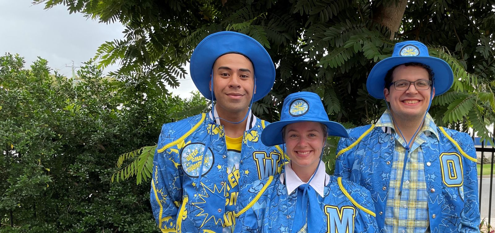 Three young people dressed up in costumes