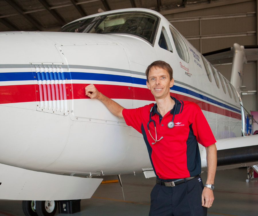 dean leaning on aircraft