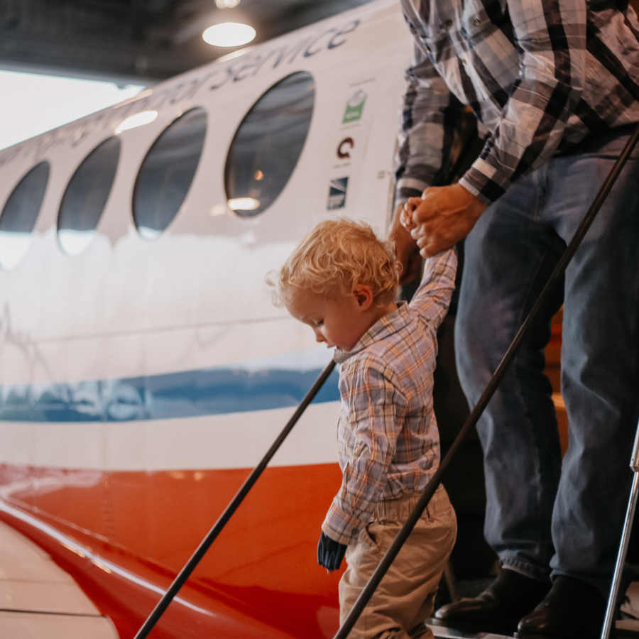 Fraser coming out of aircraft
