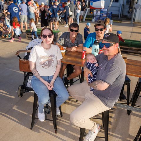 Families enjoying food and drink. 
