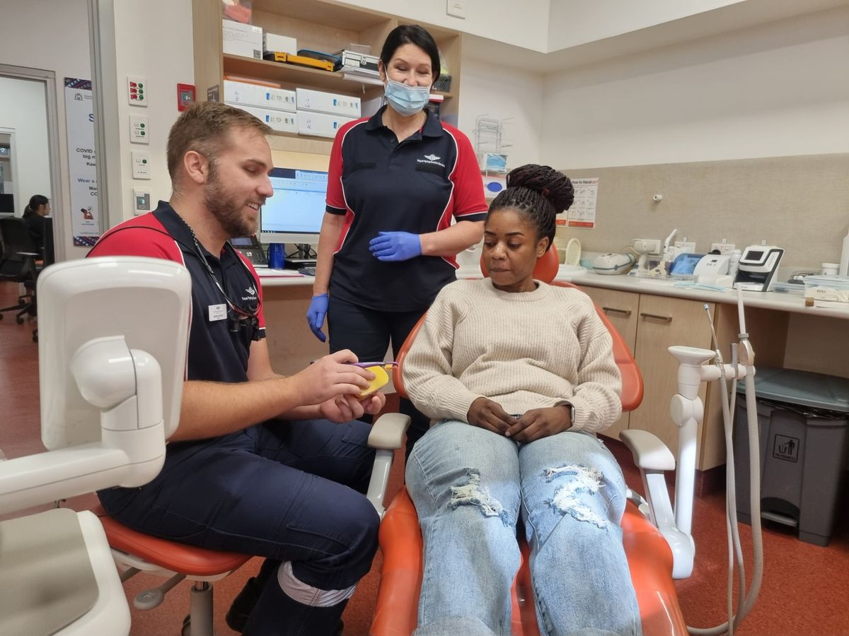 Dentist Michiel De Beer and Dentist Alexandra Dreher with a patient