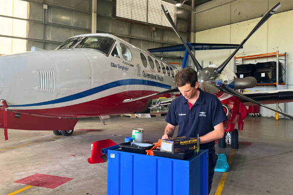 Engineer, Nic in working in front of aircraft