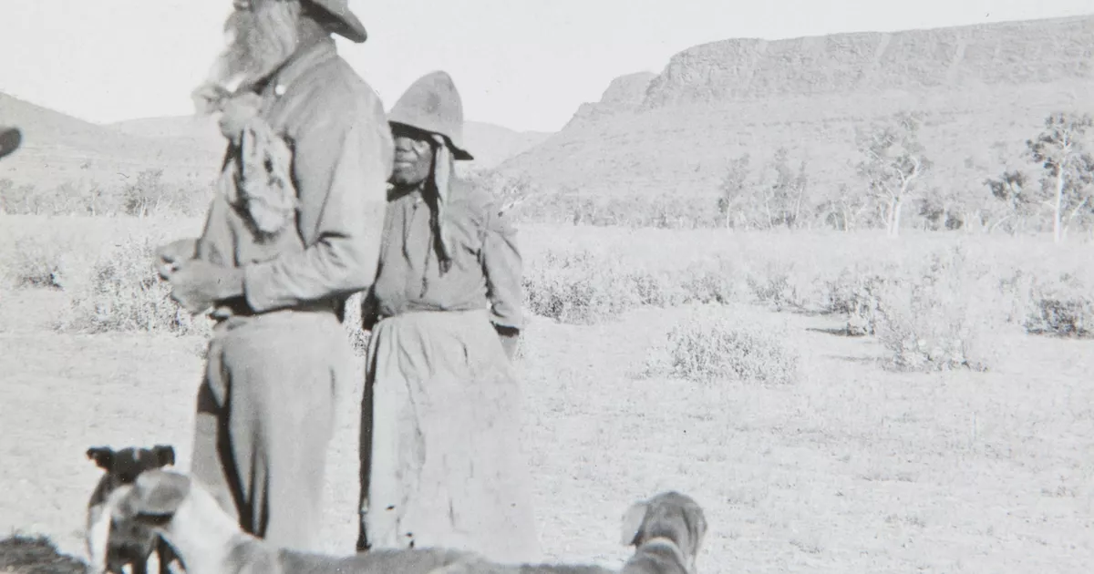 Eastern Arrernte mand and woman with three dogs - AGSA Collection
