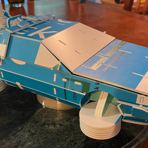 photo of a scaled down DeLorean model made from signage waste material