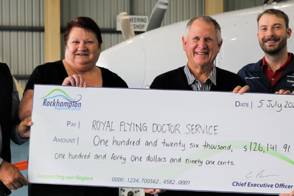 RFDS receiving cheque from Rockhampton Regional Council 