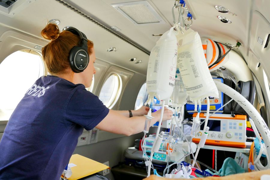 Flight Nurse prepares inflight infusion