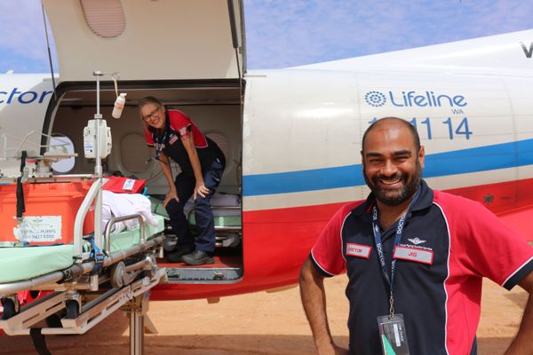 Dr Jig smiling in front of a PC-12.