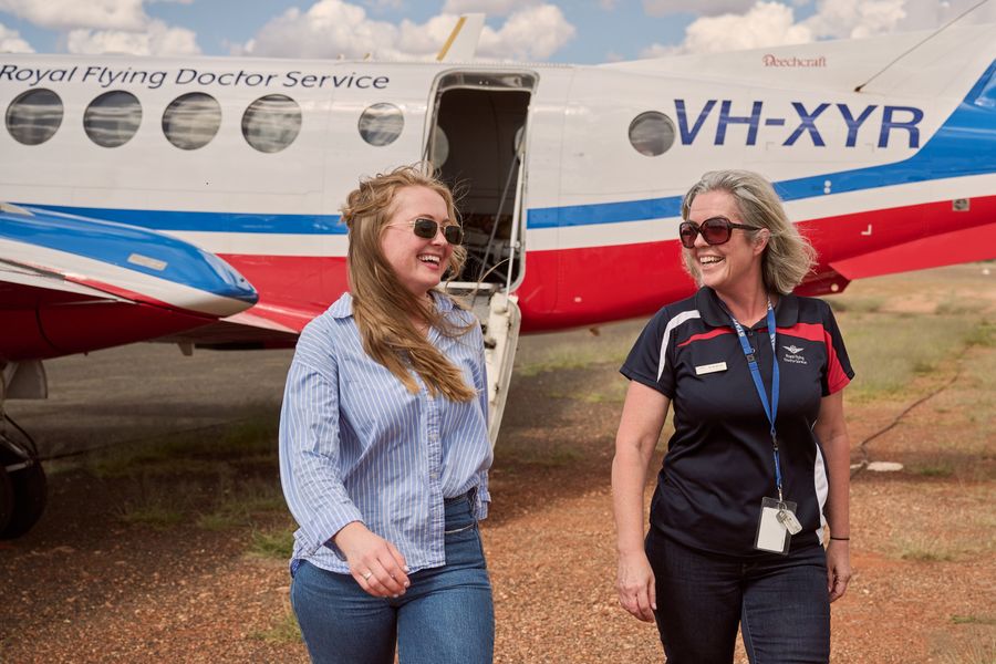 Dr Angela Gray in front of RFDS plane