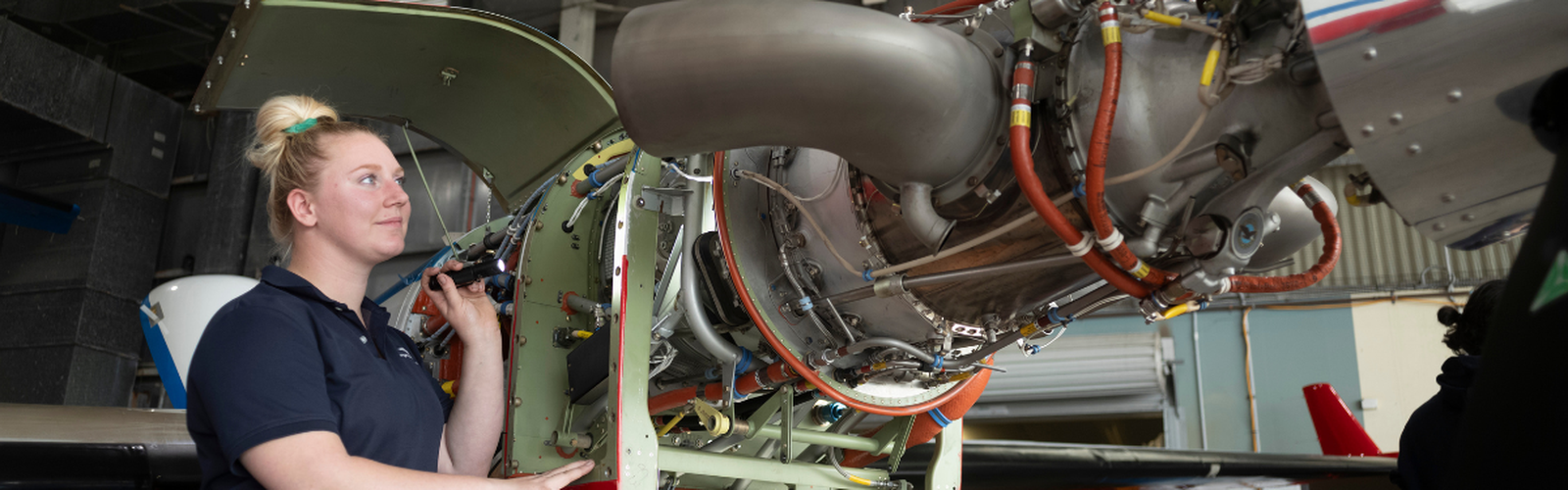 Cate working in the hangar