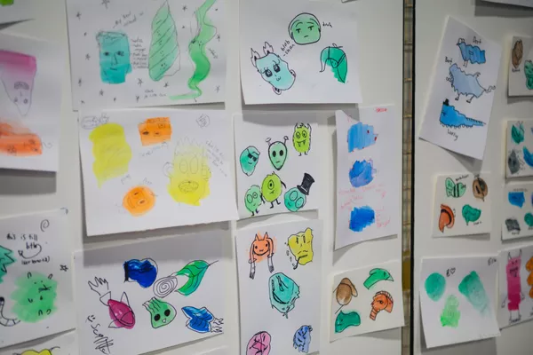 Display of Neo Ambassador activity 'Blob Monsters' stuck up on wall.