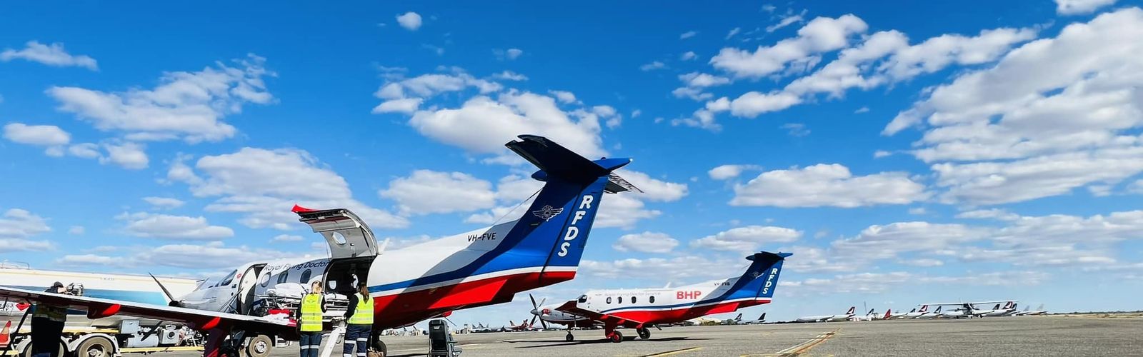 Chief Exec RFDS Emma Buchanan receiving award from Cathy Johnson from Readers Digest
