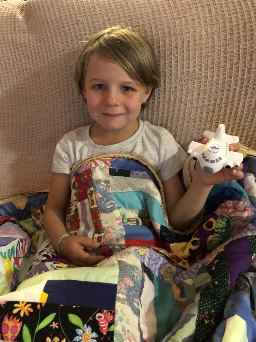 Clare pictured with the toy and blanket provided by RFDS supporters