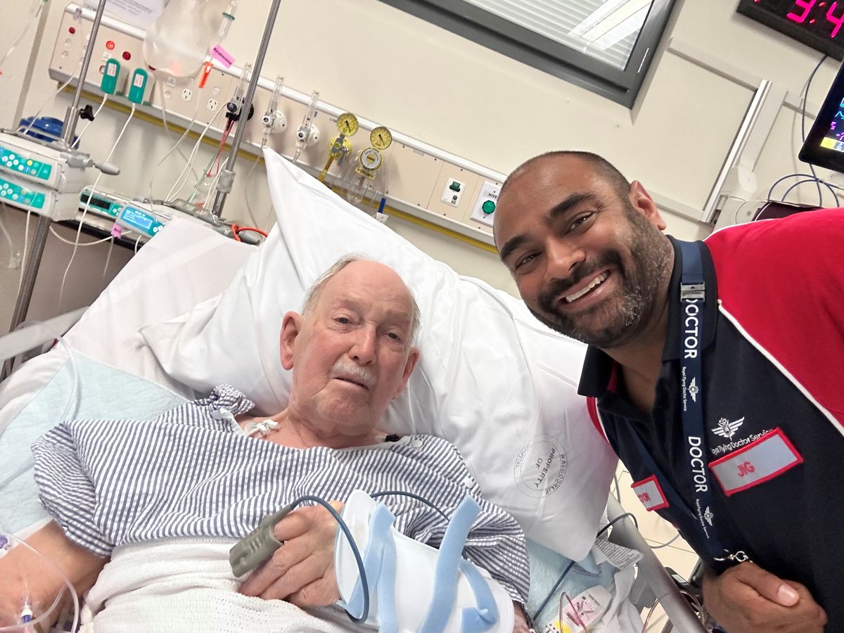 Dr Jig smiling with Terry who is in the Hospital.