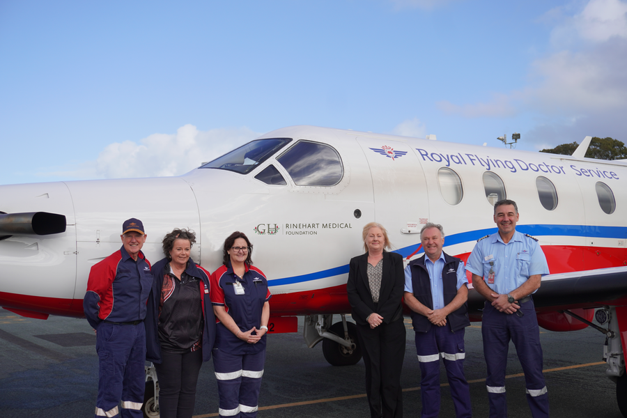RFDS staff with a PC-12 bearing the Rinehart Medical Foundation logo