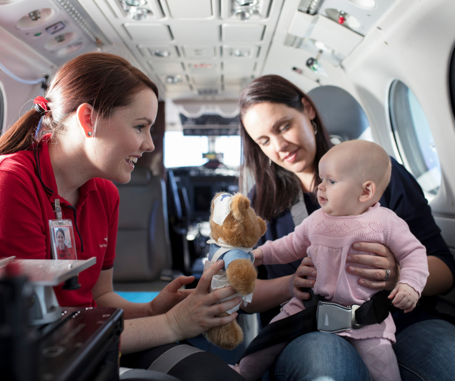 Haidee on board aircraft with patient