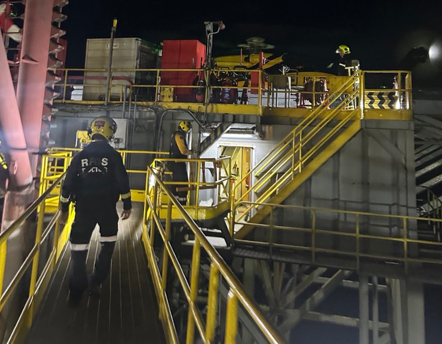 Paramedic walking through mine