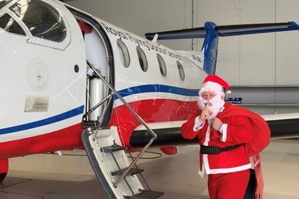 Santa hopping onto a plane