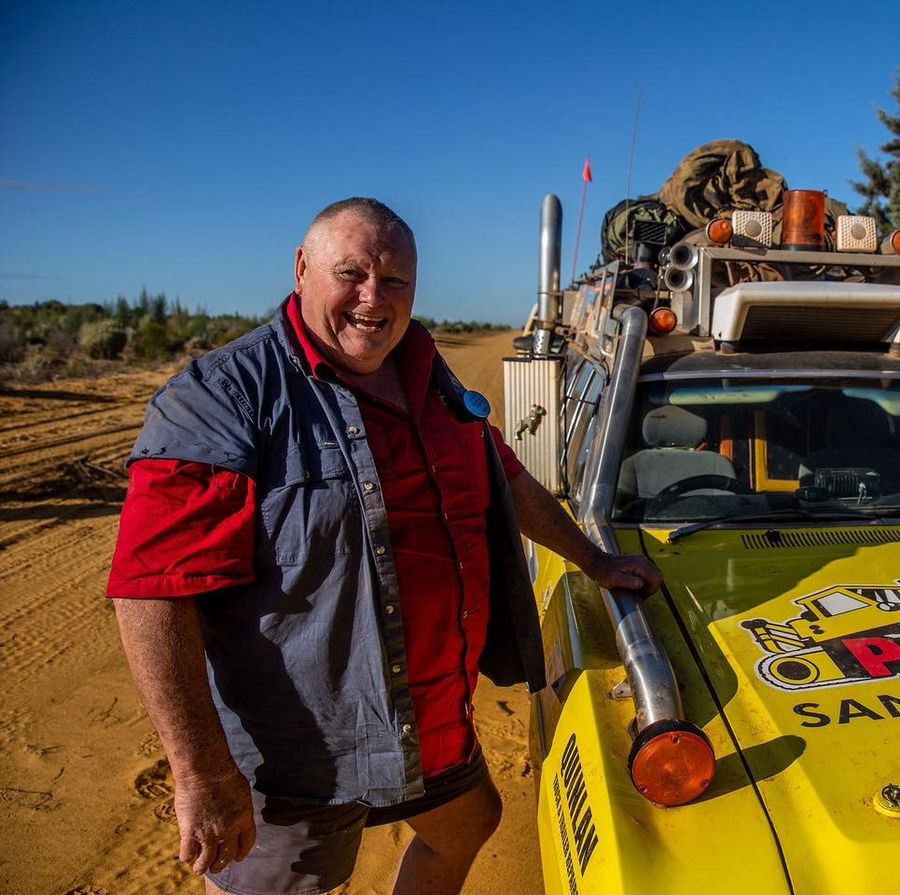 John with trek car in the bush