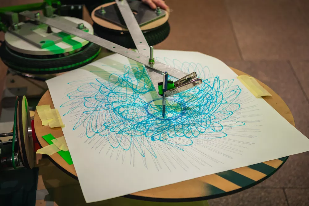 James Dodd Drawing machine in action, with pen attached to bike machinery to create a unique drawing.