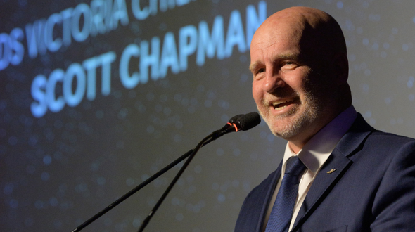RFDS Victoria Chief Executive, Scott Chapman speaks before a podium at the Going The Distance Gala Dinner.