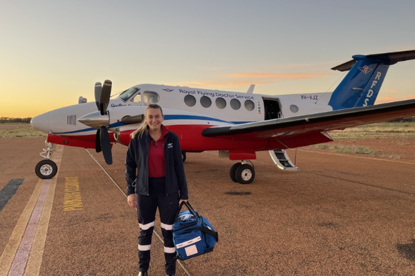 RFDS Flight Nurse Izzy standing in front of RFDS aircraft