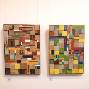 two rectangular pictures made of coloured and natural offcuts of wood