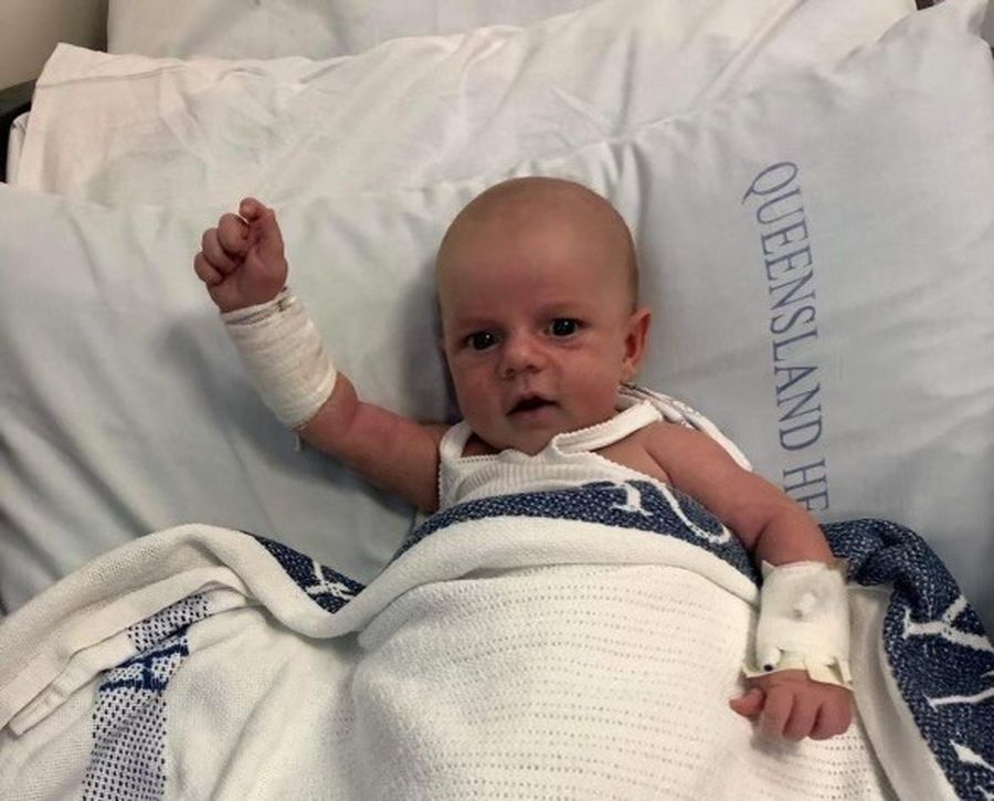 Baby Jack is laying in a hospital bed with medical equipment.