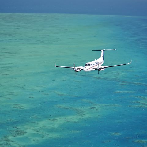 B350 Aircraft over bllue sea