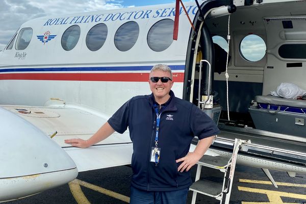Michael Cooke in front of plane 