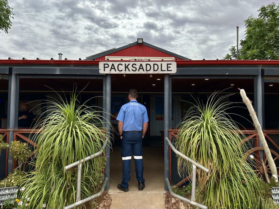Pilot standing in the doorway at Packsaddle