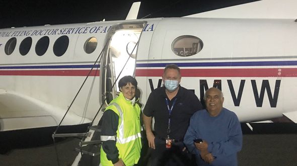 Patient Mervyn Bishop with RFDS Doctors in front plane