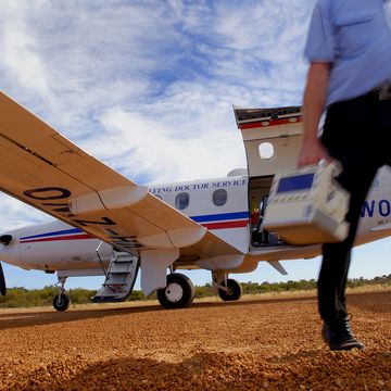 Dr leaving an RFDS plane to see a patient