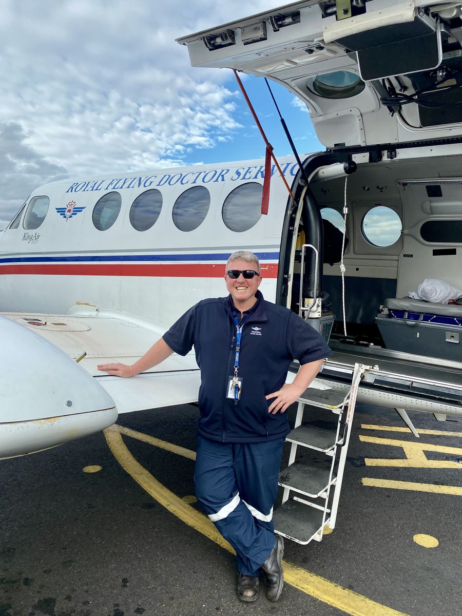 Michael Cook in front of RFDS plane 