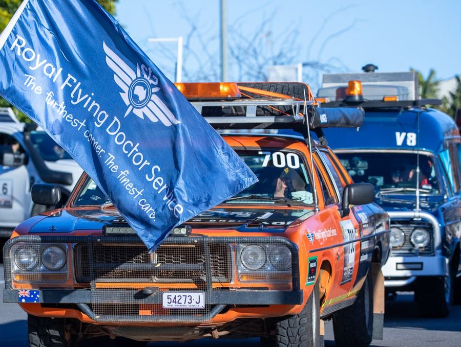 RFDS flag waving over 2024 Trek car at start line 