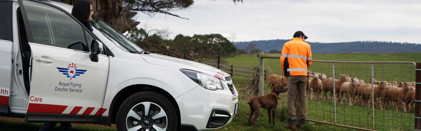 Nicole with Rhys and sheep
