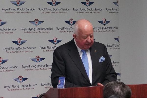 Judith Barker and Sam Walsh standing with the Life Member recipients