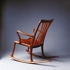 A finely detailed quiltered Tasmanian blackwood rocking chair.