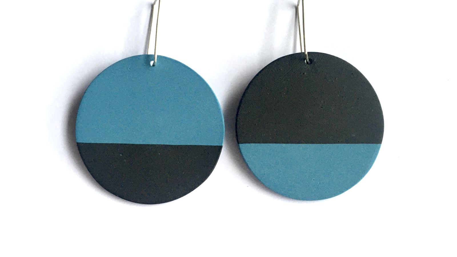 Round black and blue porcelain earrings with sterling silver hooks.