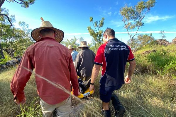 Transferring a patient through rocky terrain