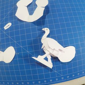 white paper bush turkey template placed on a blue cutting board