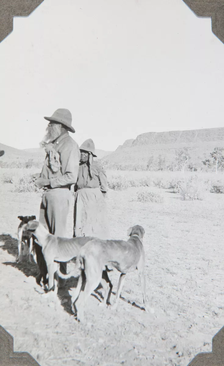 Eastern Arrernte mand and woman with three dogs - AGSA Collection