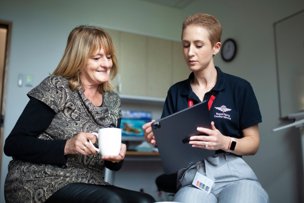 An RFDS employee speaks with a client