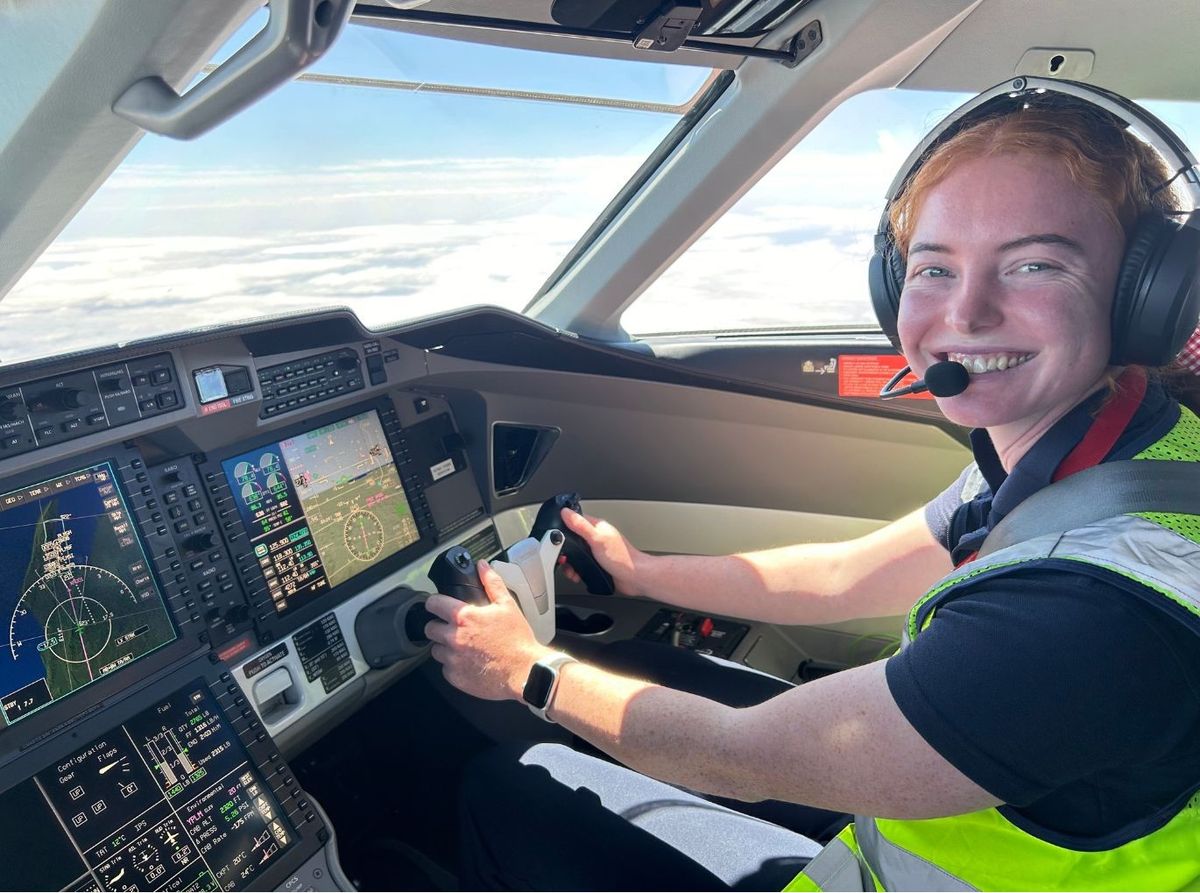 Tessa smiling in the cockpit of a PC-12