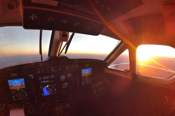 landing a plane in sunset